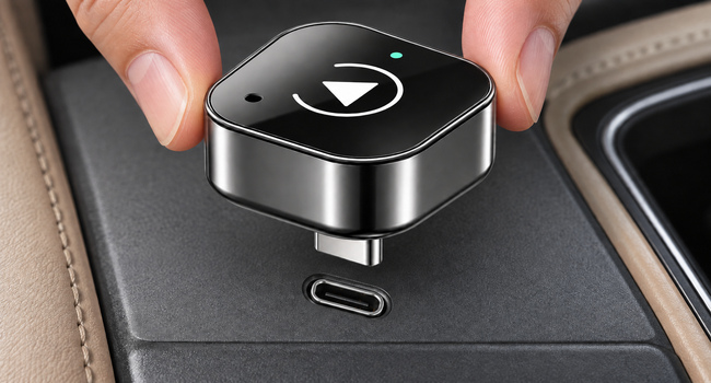 323C · NEW_PLAY native USB-C male plug shown above the corresponding vehicle data socket before insertion.