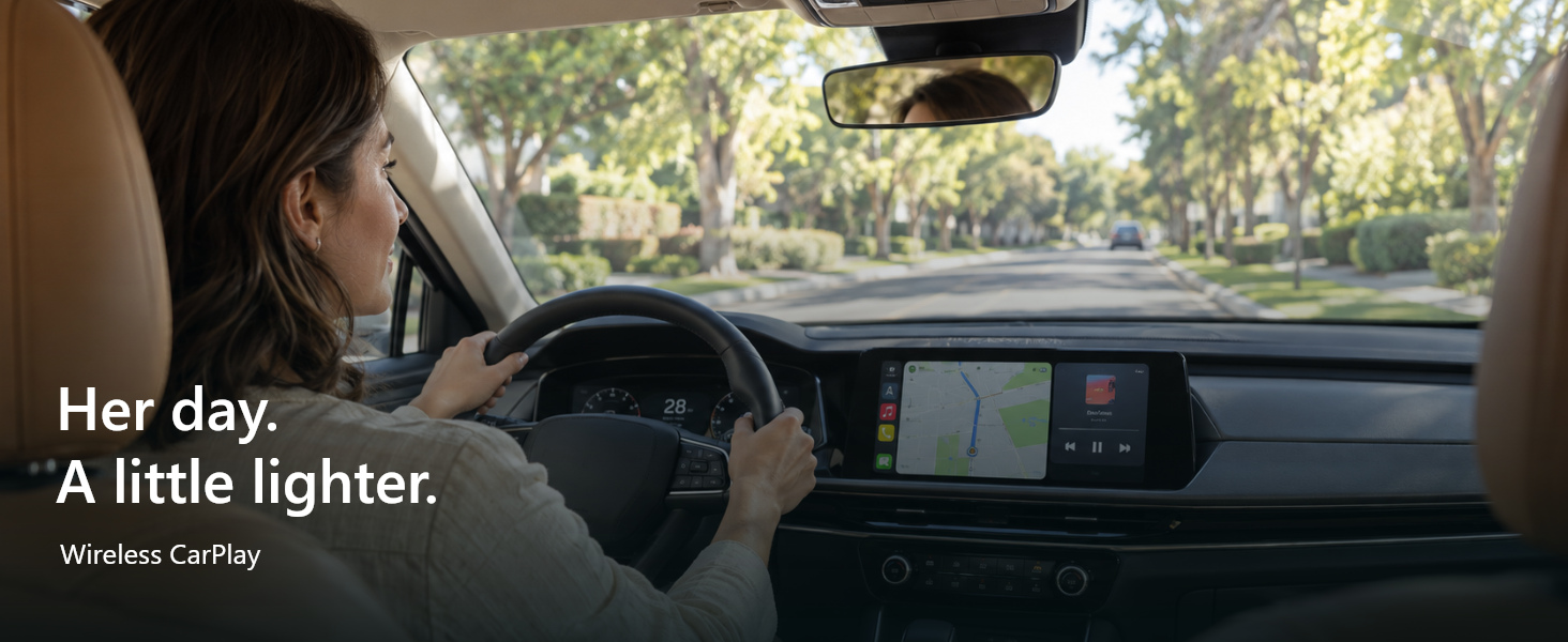 A woman uses a CarPlay-equipped vehicle on a daytime drive.
