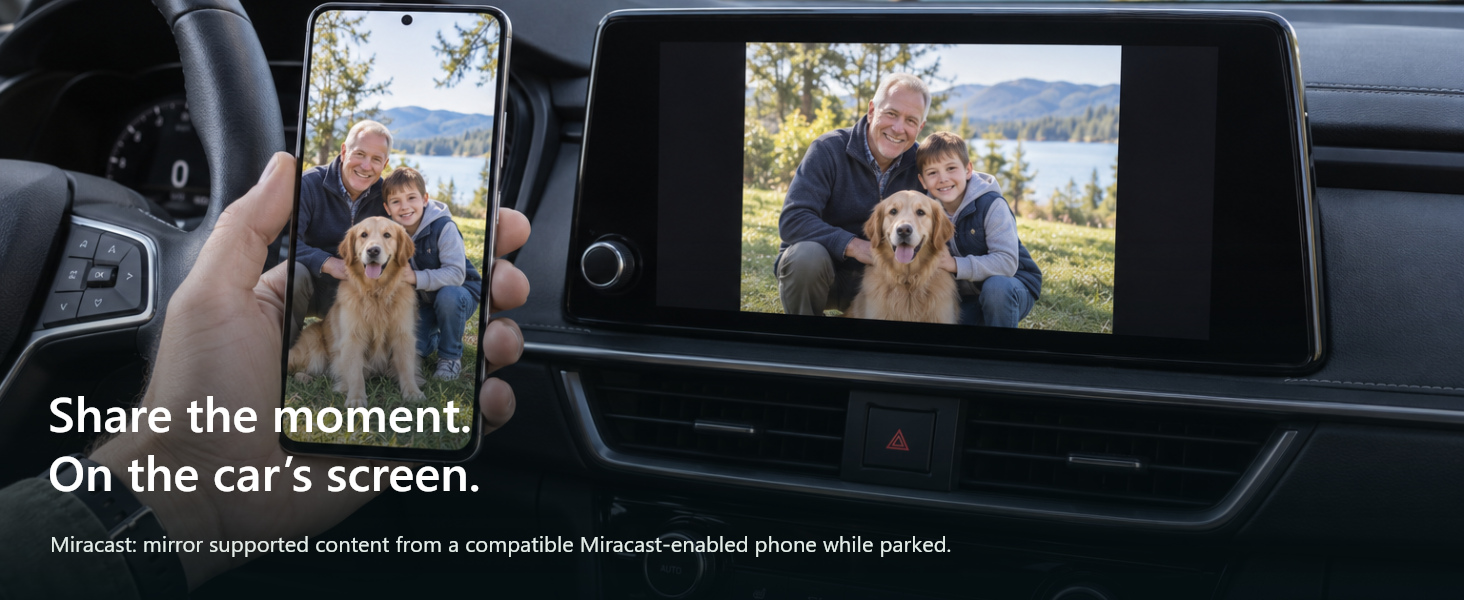 Phone and car display show the same personal photo while parked.